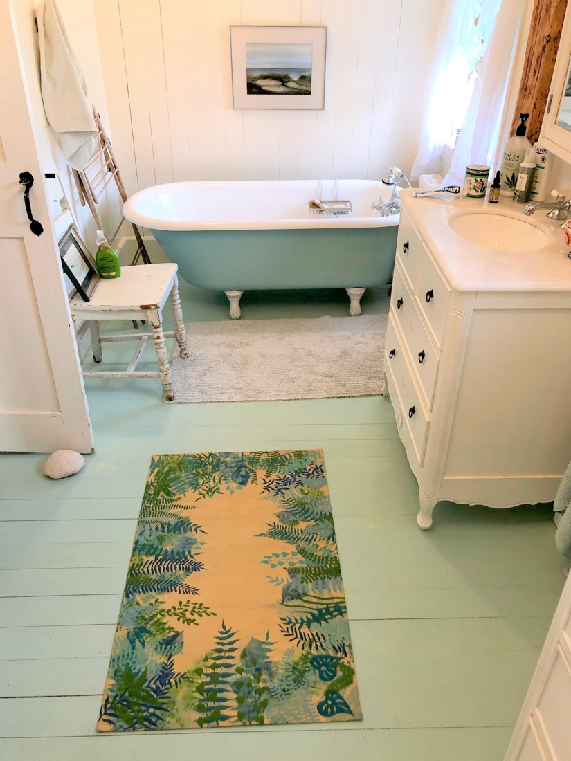 Perfectly themed bathroom with matching canvas bath mat
