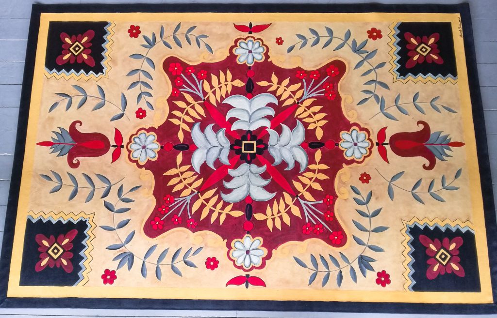 Canvas rug painted to look like colonial tile
